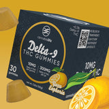 Cannabis Life Yuzu Euphoria Delta-9 THC Gummies box surrounded by yellow gummies and yuzu fruit on a golden background.