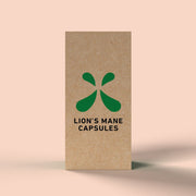 Side of Green Roads Lion’s Mane Capsules box featuring a green symbol and black product lettering on a peach background.