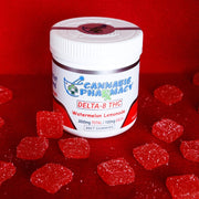 Colorful Cannabis Pharmacy 100mg THC Gummies in a jar, offering 100mg of Delta 8 THC per gummy for pain, anxiety, and sleep relief.