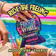 Hands holding a Ferris Wheel Watermelon gummies pouch beside a pool, with a colorful float and drink in the background.