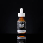 CBDMD CBD Tincture - Full Spectrum 1500mg bottle with white topper on a black background