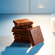Road Trip Desert Stardust Mushroom Chocolate Bar - Milk Chocolate — a stack of milk chocolate pieces.