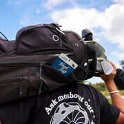 Road Trip Desert Stardust Mushroom Gummies — a gummy pouch tucked into a backpack.