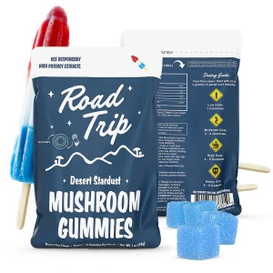 Alt Text: Road Trip Rocket Pop Mushroom Gummies pouch displayed with red, white, and blue rocket pop popsicles and sugar-coated blue mushroom gummies in front.