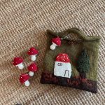 Mushroom House Handmade Wool Handbag featuring a cute vintage mushroom house design and woven craftsmanship.